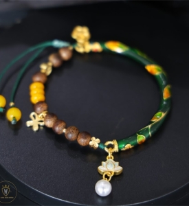 Vòng tay trầm hương mix charm hoa sen ngọc 